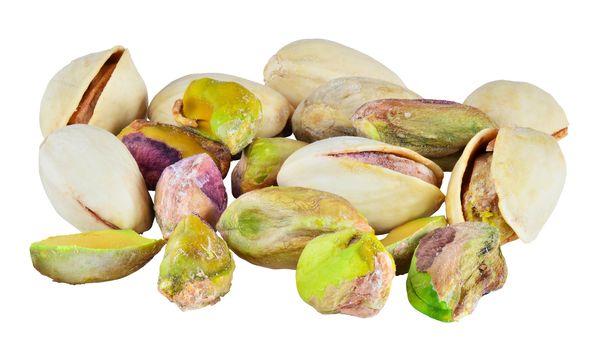 Randoom group of pistachio nuts. Isolated with path on white background. Macro image with big depth of field.
