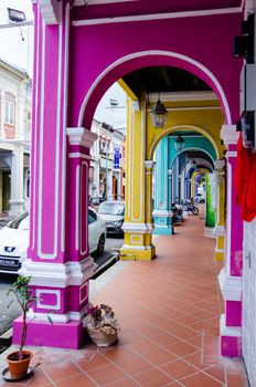 Penang, Malaysia. Color architecture narrow streets with people. Dirty moldy humidity cityscape