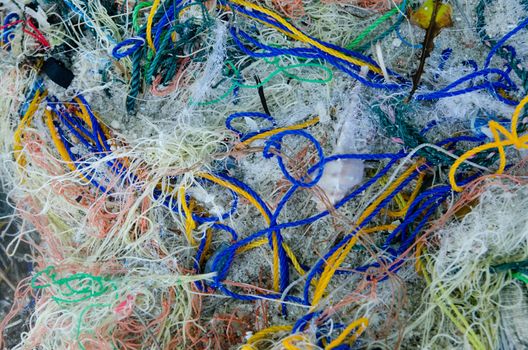 Background of color fishing net and cord rope laces line on the heap