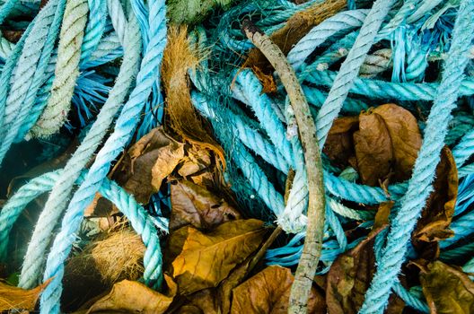 Background of color fishing net and cord rope laces line on the heap