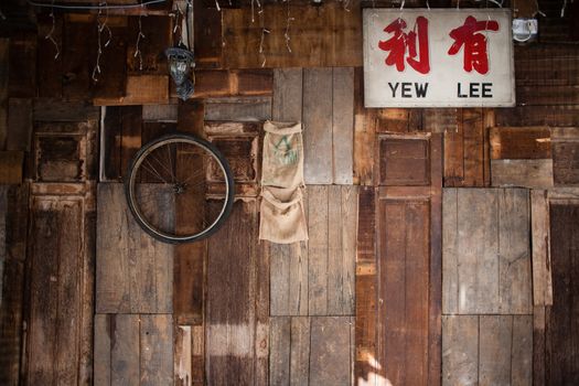 Wall with old wooden boards and boxes in garage