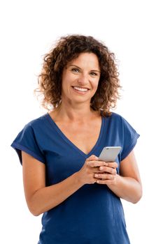 Beautiful woman with mobile phone sending a text message