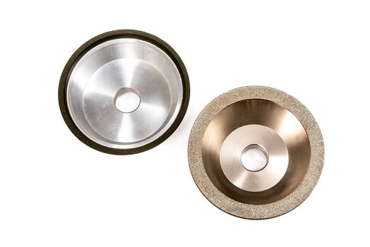 Industrial grinding and polishing wheels on white background