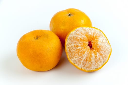 Ripe oranges isolated on white background. Orange in a cut.