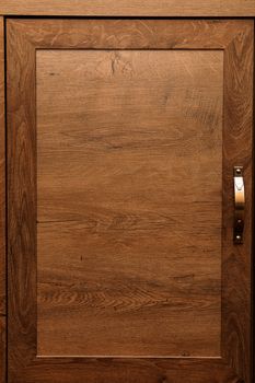 detail of decorated furniture drawers. old drawer - damper. Close-up detail of high quality Oak wood cabinets with bronze cabinet hardware drawer pulls