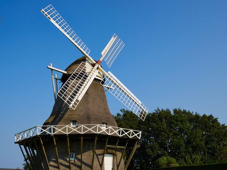 Traditional old Danish windmill in the countryside Funen Denmark