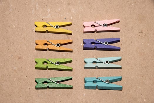 Colorful wooden clothespin. Background of colorful clothes pegs. Closeup of colorful clothespins.

