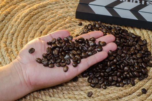 Coffee in hand  on a jute rope.