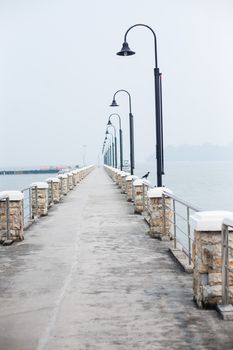 Wooden pier on the sea background, bridge near tropics. Color panorama