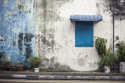 Pahang, Malaysia architecture narrow streets. Dirty moldy humidity wall on cityscape