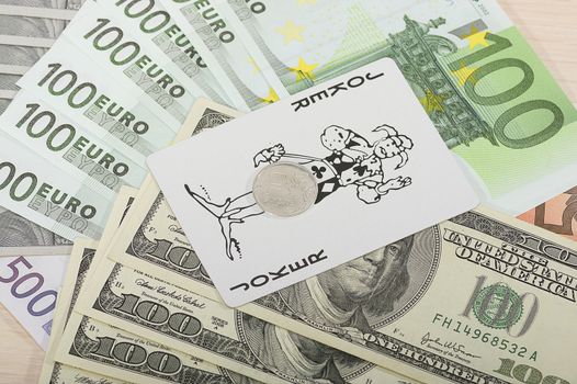 Different money bills and coins lie on the table close-up