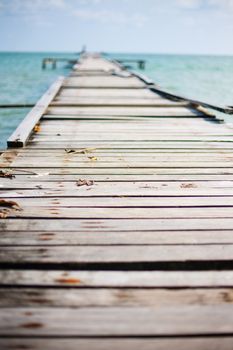 Penang island Malaysia. Wooden pier on the sea background, destroyed bridge near tropics. Color panorama