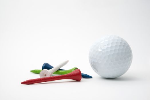 golf ball and wood tees