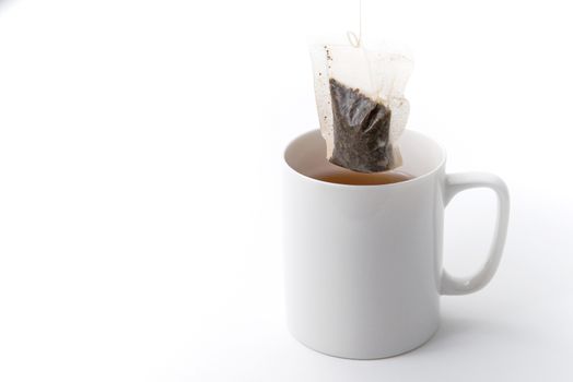 tea cup with tea bag isolated on white