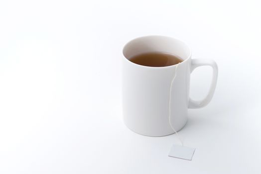 tea cup with tea bag isolated on white