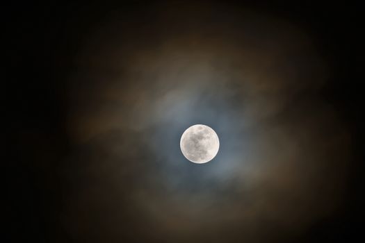 Snow Moon Full Moon Rising with Storm Clouds