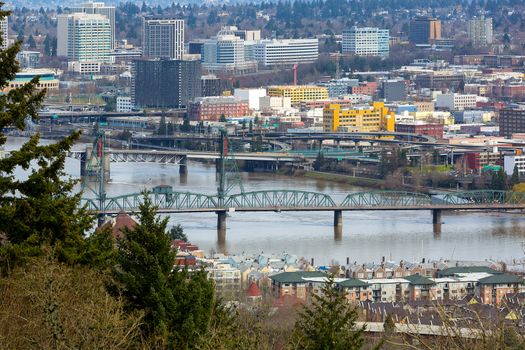 Hawthorne Bridge by waterfront condominiums over Willamette River in downtown Portland Oregon