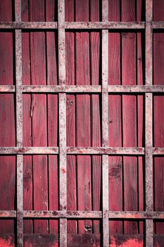 background or texture Iron lattice on a wooden door