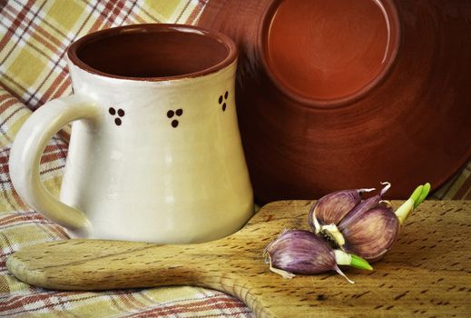 food background Pottery Still Life and garlic