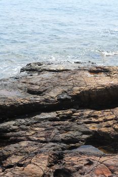 Nice black volcanic stone structure near sea