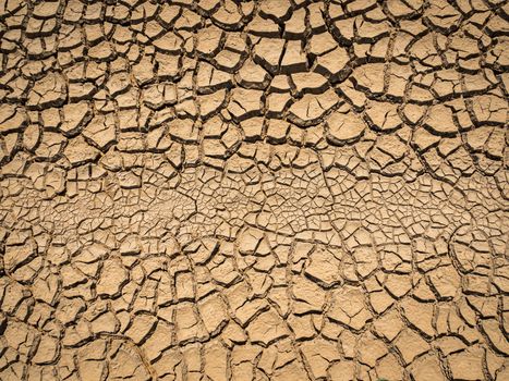 dried and cracked soil in arid season.
