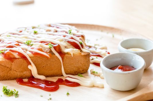 Pizza toasted bread with tomato sauce and ham cheese selective focus.