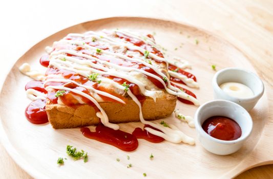 Pizza toasted bread with tomato sauce and ham cheese selective focus