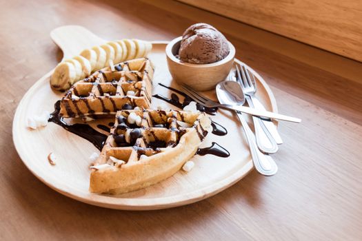 Belgian waffles with fruit and chocolate, forest fruit, all homemade, delicious batter.