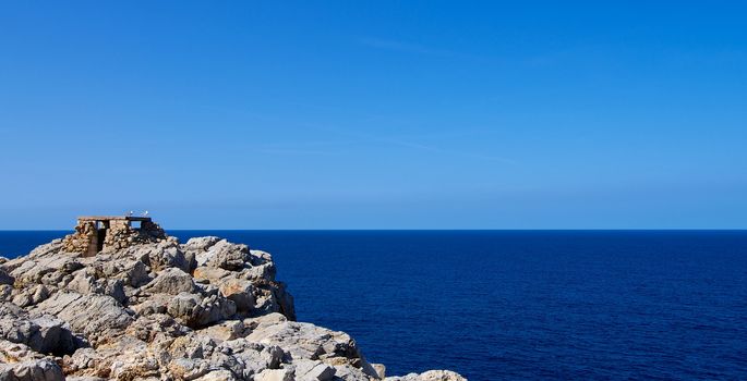 Historical Artillery Facilities near Punta Nati against Blue Sky Outdoors. North West of Menorca, Balearic Islands 