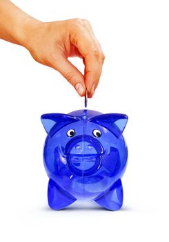 Woman's hand putting coin into piggy bank, isolated on white with path
