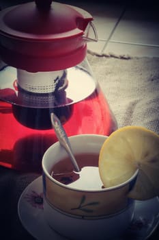 photo top vertical view of tea cup with tea kettle