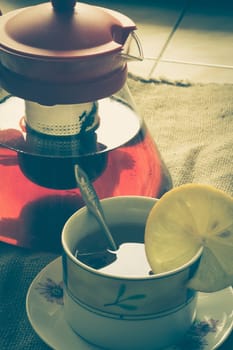 photo top vertical view of tea cup with tea kettle