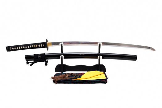 Japanese sword on stand with white background