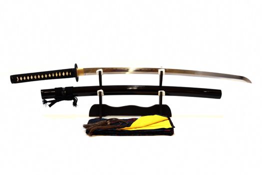 Japanese sword on stand with white background