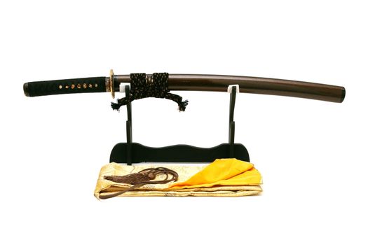 Japanese sword on stand with white background