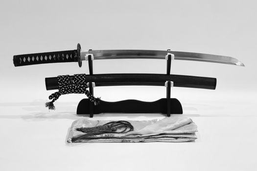 Japanese sword on stand with white background