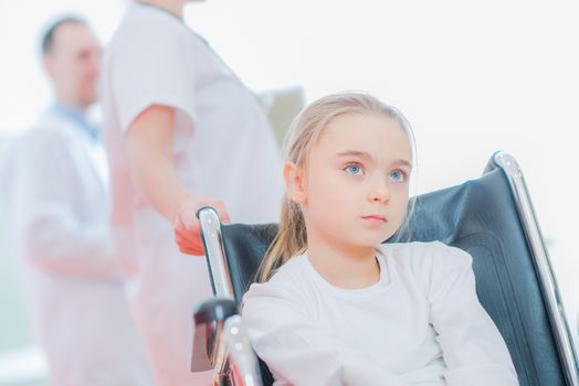 Caucasian Girl on the Wheelchair in the Hospital.