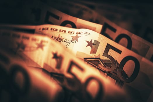 Conceptual Euro Money Photo in Dark Sepia Like Color Grading. Euro Banknotes Closeup.