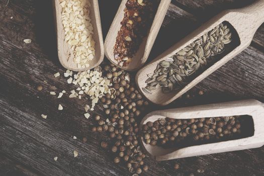 Full of Aroma Spices in the Wooden Kitchen Tools. Four Spices.