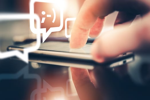 Mobile Messaging and Chatting Concept Photo. Smartphone, Touching Finger and the Chatting Icons.