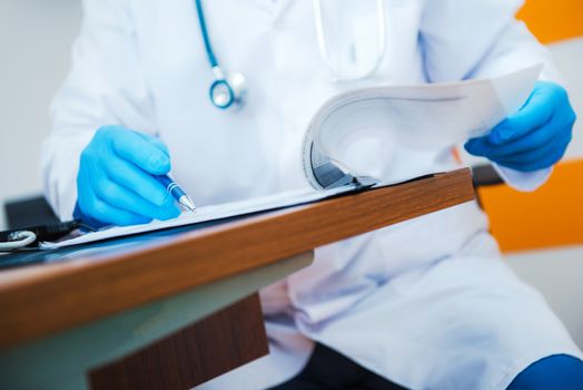 Prescription Writing by Doctor. Doctors Office Desk. Healthcare Concept.