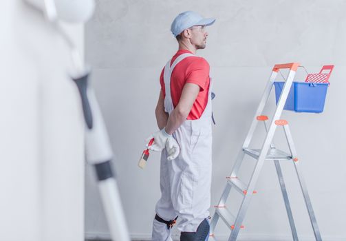 Room Painter and His Job. Apartment Remodeling Concept.