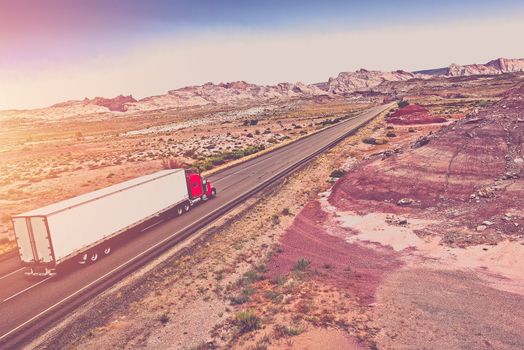 Truck Transport Concept. Semi Truck on the American Desert Highway.