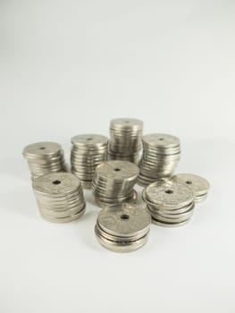 piles of norwegian coins kroner on a white background