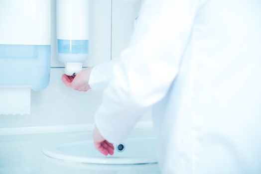 Doctor Hands Disinfection by Special Medical Use Soap. Hand Cleaning in the Clinic.
