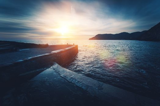 Mediterranean Sea Sunset. Vernazza in Province of La Spezia, Italy. Dark Blue Color Grading.