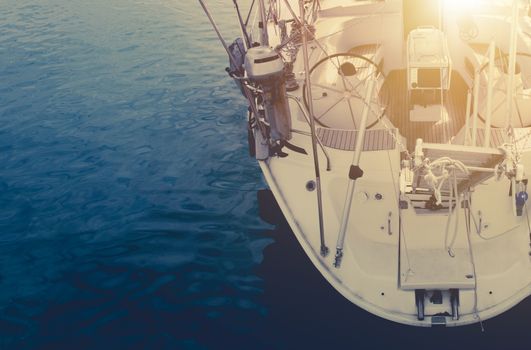 Open Sea Yachting Time Boating Photo Concept. Yacht on the Blue Water Closeup Photo.