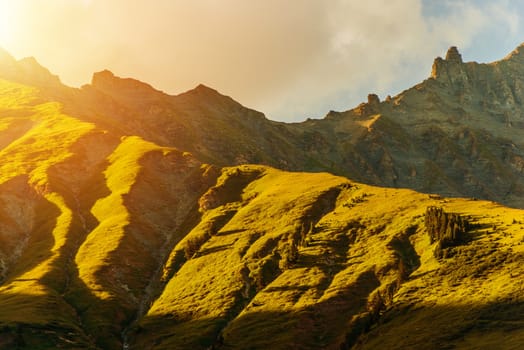 Alpine Mountain Sunset. Scenic Mountain Range During Golden Sunset.