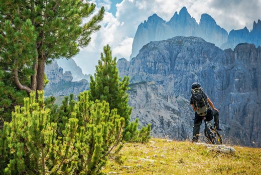 Biker on the Biking Trail in the High Mountains. Outdoor Recreation and Sport.