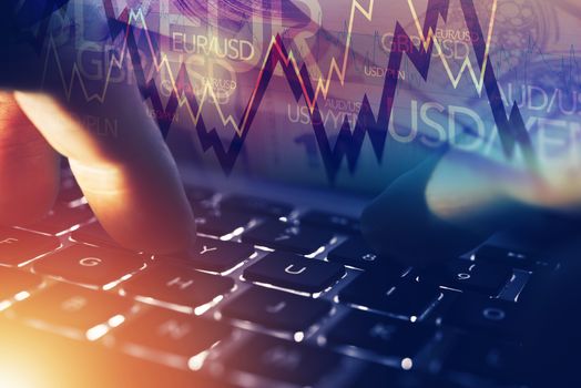 Forex Online Player. Forex Currency Trading Online Concept with Hands on the Laptop and Trading Stats. 